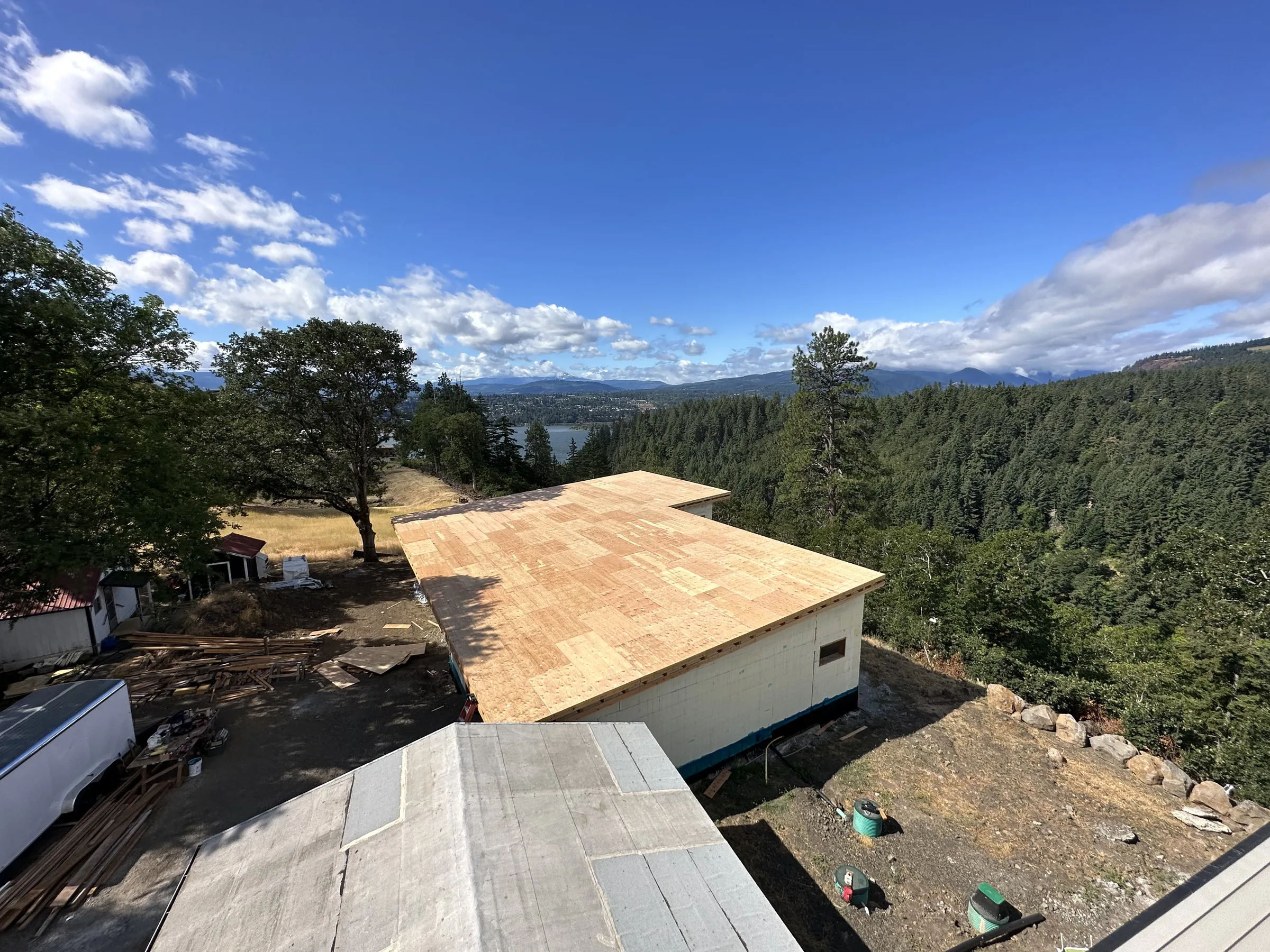 The ridge build above the Columbia — Full height ICF walls carrying an engineered roof deck, built right at the edge of the cliff